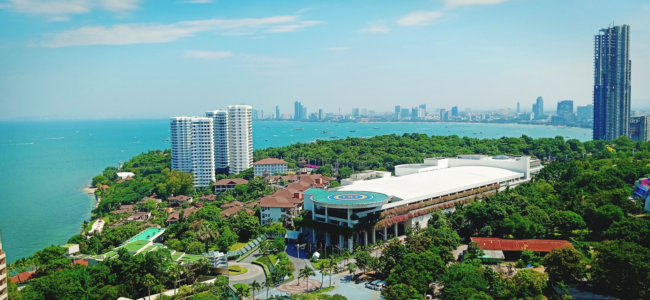 high-angle-view-swimming-pool-by-buildings-against-sky (1)